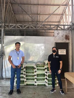 Allan Sayson of PAGCOR (left) with Jaymar Pepano, head technician for Ortiz Asia and some of the food supplies distributed.