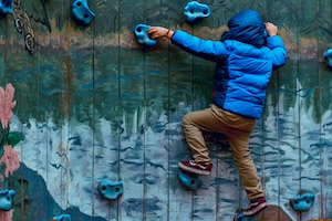 Child rock climbing