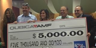 Image: Left to right, booth hostess, Emanuele Govoni, CEO, QubicaAMF, Alaina Crabtree, contest winner, Pat Ciniello, chairman of the board, QubicaAMF, Juan Cabezas, president and chief growth officer, QubicaAMF