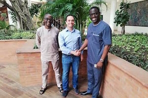 Richard Mifsud, Helio Gaming CEO (centre) shakes hands on the deal with Olumuyiwa Awosile, MD at Hammer Lottery (right) in Lagos, Nigeria